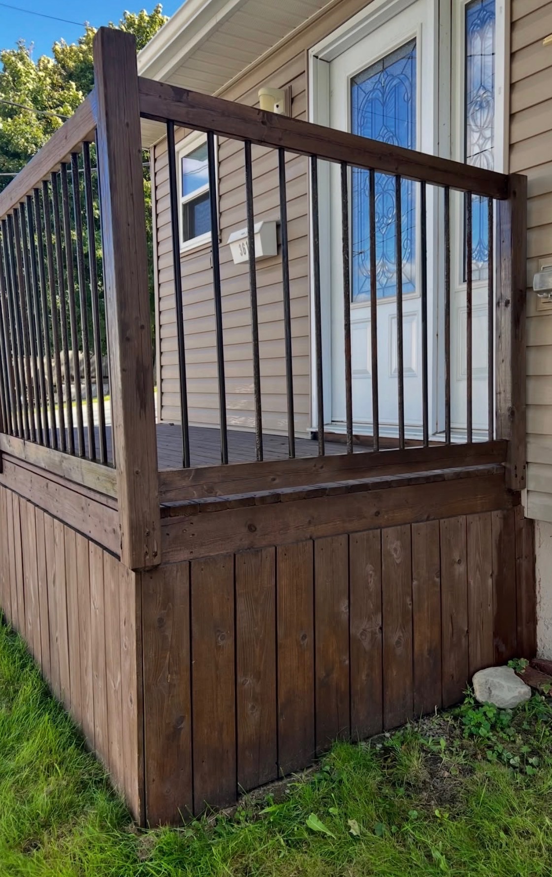 After - pressure washed and stained deck railing