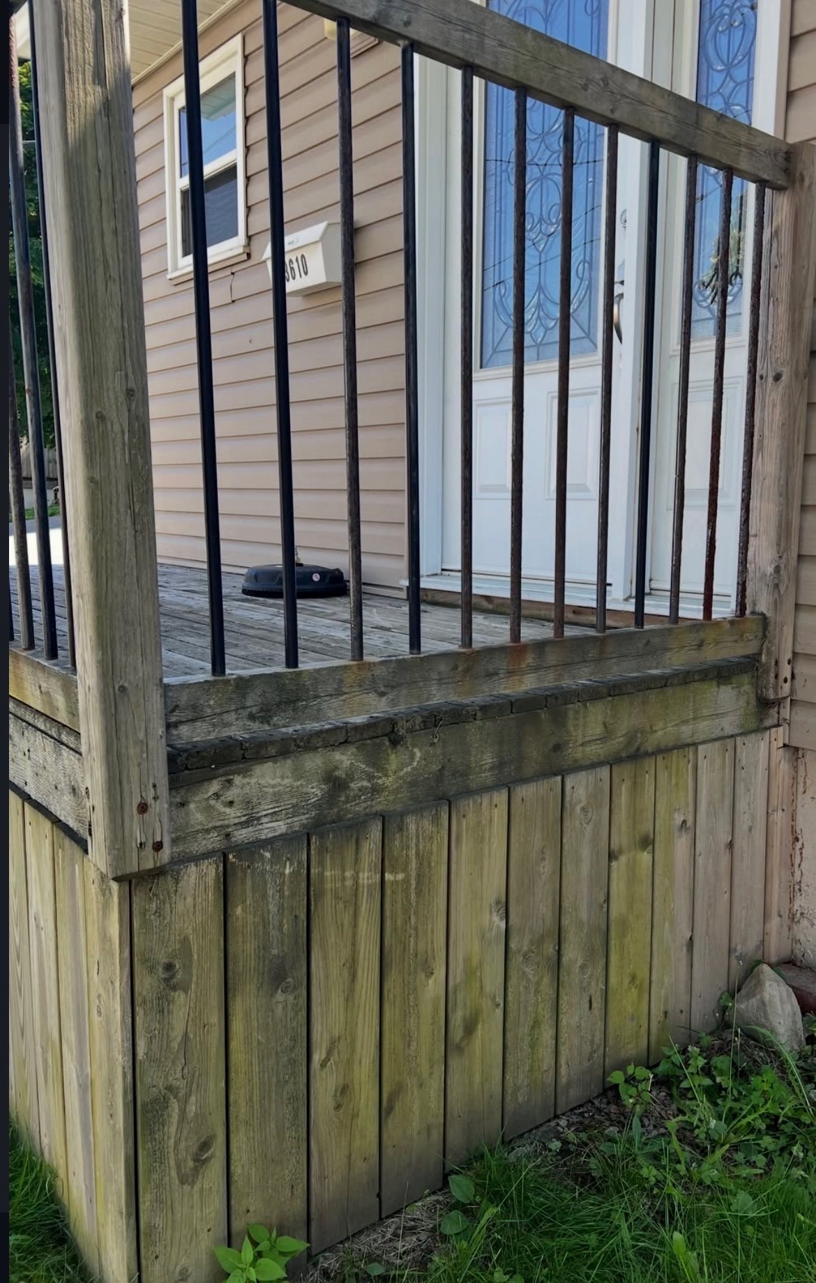 Before - weathered deck railing